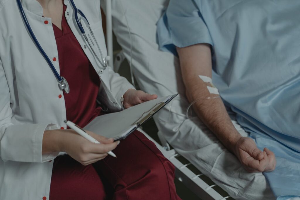 doctor by patient bedside