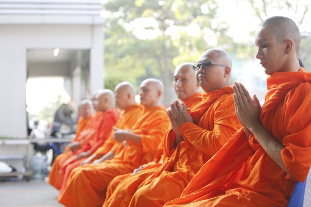 monks sitting in prayer