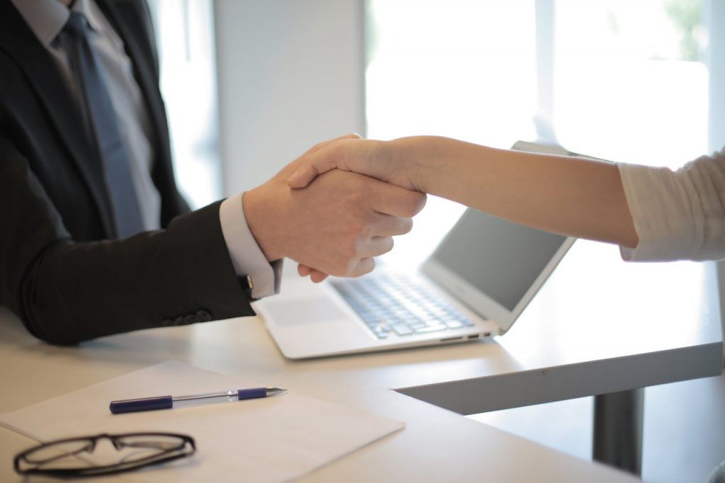 Handshake between man and woman