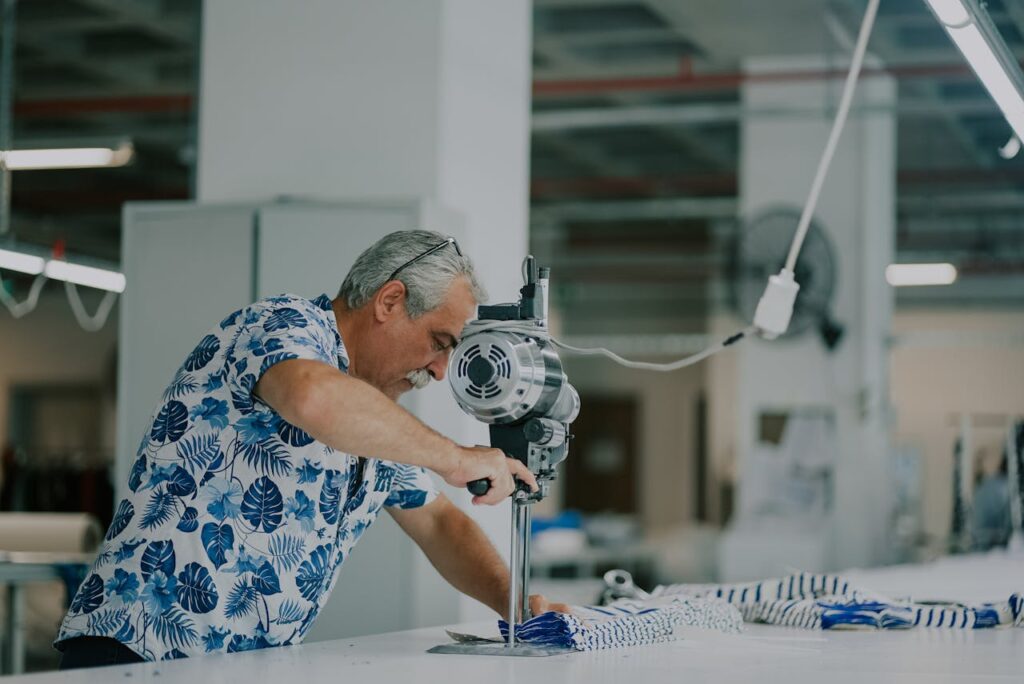 older worker operating machine